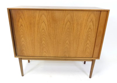 Lot 355 - A 1960s Danish teak low side cupboard, having...