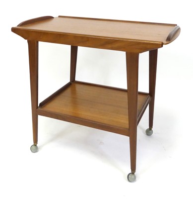Lot 360 - A 1970s Danish teak two-tier tea trolley, each...