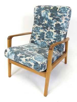 Lot 358 - A 1960s teak framed armchair, having shaped...