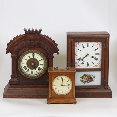Lot 147 - An American faded mahogany cased mantel clock,...