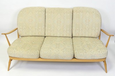 Lot 313 - An Ercol blond beech stickback three-seater...
