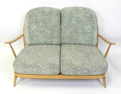 Lot 314 - An Ercol blond beech stickback two-seater...