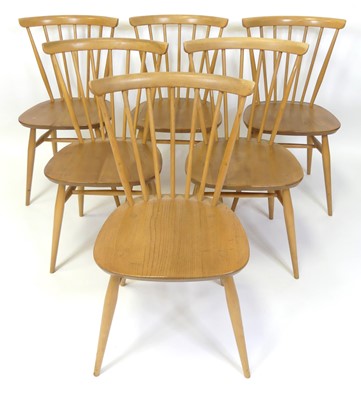 Lot 312 - A set of six Ercol blond elm stickback dining...