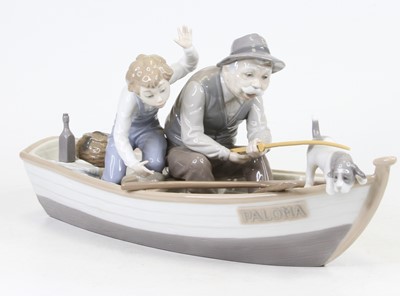 Lot 5 - A Lladro porcelain figure group of a gentleman...