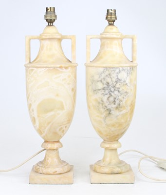 Lot 12 - A pair of yellow polished hardstone table...