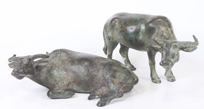 Lot 38 - Two verdigris metal models of oxen, the...