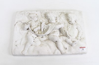 Lot 58 - A plaster relief plaque, decorated with putti,...