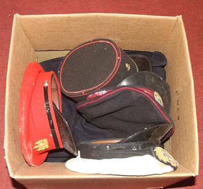Lot 90 - A collection of military caps and uniform