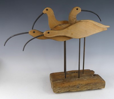 Lot 20 - A carved pine and iron sculpture group of four...