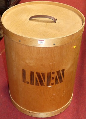 Lot 1284 - A 1970s plywood cylindrical linen box and...