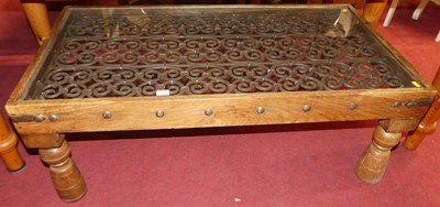 Lot 1287 - An Eastern teak, metal bound and iron inset...