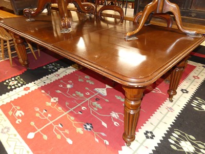 Lot 1308 - A mahogany round cornered extending dining...