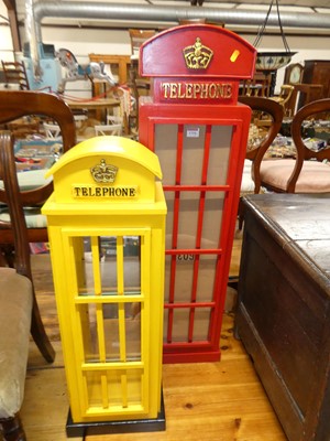 Lot 1310 - Two table-top model painted telephone boxes,...