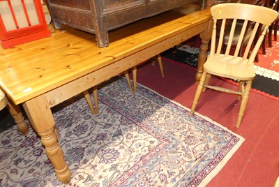 Lot 1311 - A modern stained pine farmhouse kitchen table,...