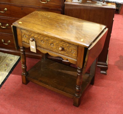 Lot 1354 - A contemporary oak dropflap single drawer...