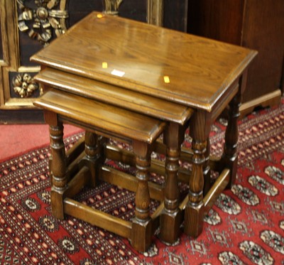 Lot 1356 - A contemporary moulded oak nest of three...