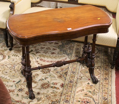 Lot 1361 - A mid-Victorian mahogany serpentine fold-over...