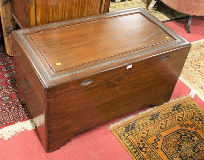 Lot 1369 - An Eastern camphor wood hinge top blanket box,...
