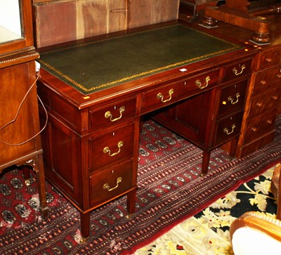 Lot 1370 - A mahogany and gilt tooled green leather inset...