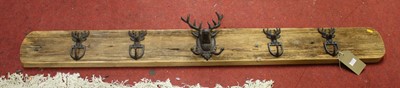 Lot 1371 - A rustic pine backed wall-mounted coat rack,...