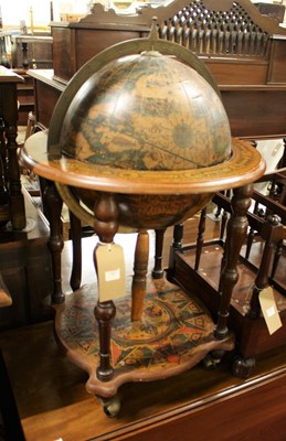 Lot 1382 - A hinged freestanding globe bar, raised on...