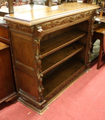 Lot 1386 - A circa 1900 heavily carved oak freestanding...