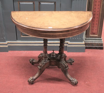 Lot 1387 - A mid-Victorian figured walnut demi-lune...