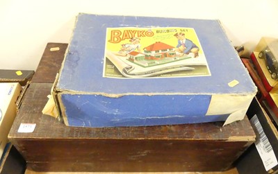 Lot 1573 - A boxed Bayko building set and a wooden box...