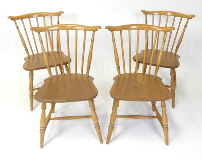 Lot 315 - A set of four Ercol blond elm stickback...