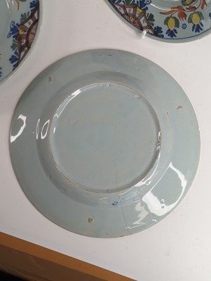 Lot 1101 - A set of four Lambeth polychrome delftware...