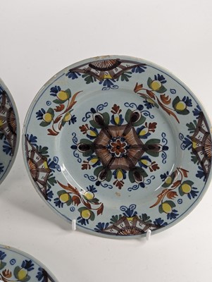 Lot 1101 - A set of four Lambeth polychrome delftware...