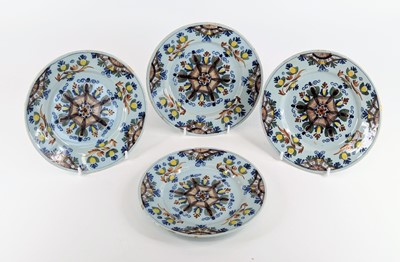 Lot 1101 - A set of four Lambeth polychrome delftware...