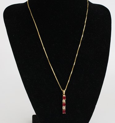 Lot 2524 - A yellow metal, ruby and diamond articulated...