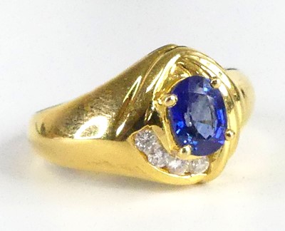 Lot 1300 - An 18ct yellow gold, sapphire and diamond...