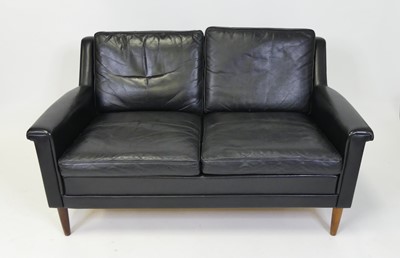 Lot 334 - A 1960s Danish black leather two-seater sofa,...