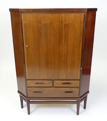 Lot 327 - A 1960s Danish rosewood corner cupboard, the...