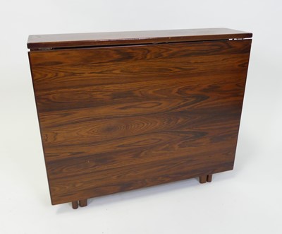 Lot 326 - A 1960s rosewood dropleaf dining table, of...