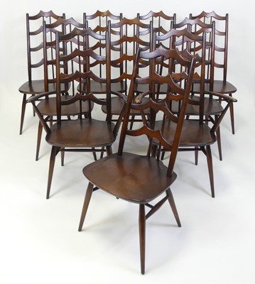 Lot 323 - A set of ten Ercol dark elm dining chairs,...