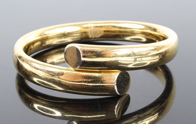 Lot 1287 - An 18ct yellow gold hinged crossover style...
