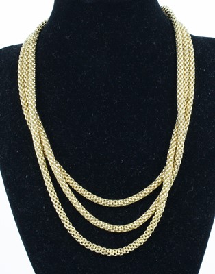 Lot 1309 - A Fope 18ct yellow gold three-strand meshlink...