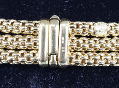 Lot 1309 - A Fope 18ct yellow gold three-strand meshlink...