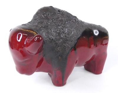 Lot 47 - A flambé volcanic glazed model of a standing...