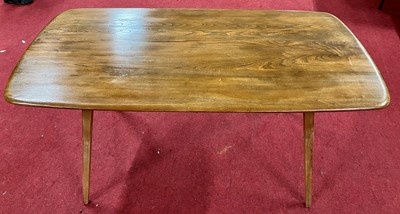 Lot 302 - A 1960s Ercol blond elm Windsor 382 dining...