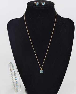 Lot 2741 - A yellow metal blue topaz suite, comprising a...