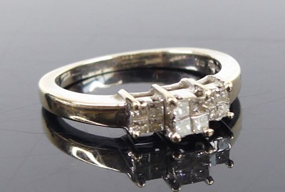 Lot 2743 - An 18ct white gold diamond tiered quatrefoil...