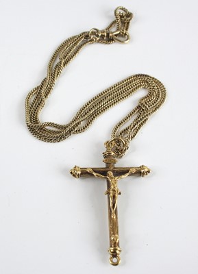 Lot 2639 - A yellow metal ornate crucifix attached to a...
