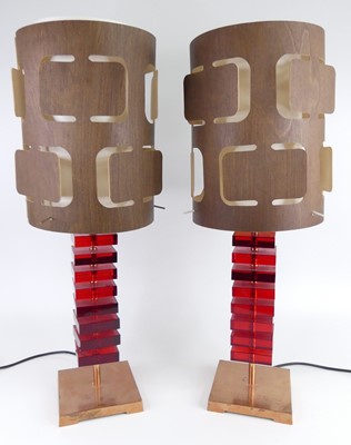 Lot 126 - A pair of contemporary ruby coloured lucite...