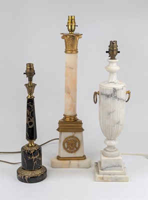Lot 14 - A collection of three polished hardstone table...
