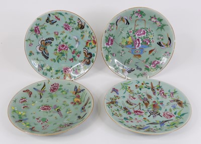 Lot 37 - A set of four Chinese celadon porcelain plates...
