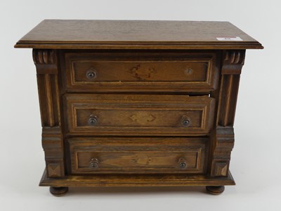 Lot 48 - A miniature apprentice type oak chest of three...